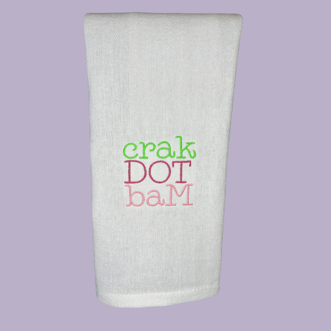 crak dot bam mahjong embroidered on a tea towel in bright, fun colors