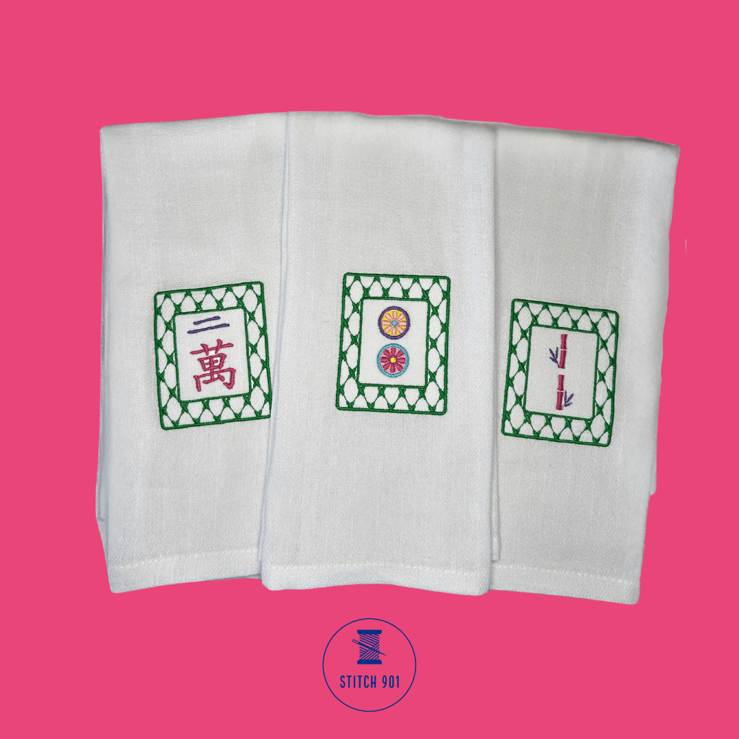 Mahjong Crak Tile Tea Towel in bright, fun colors alongside the Dot and Bam tea towels