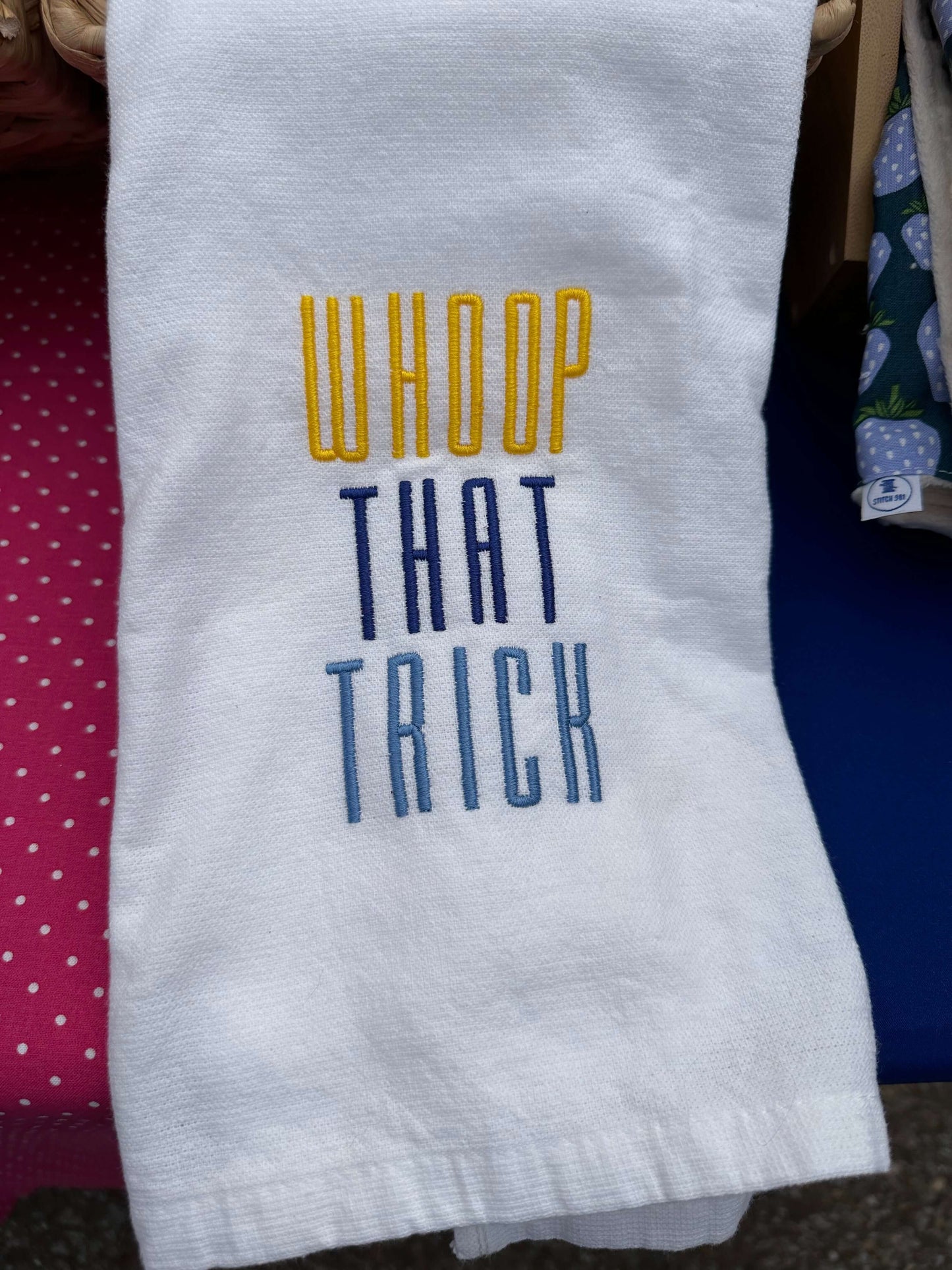 100% cotton tea towel featuring the memphis grizzlies rally phrase, “Whoop that trick” in grizzlies brand colors