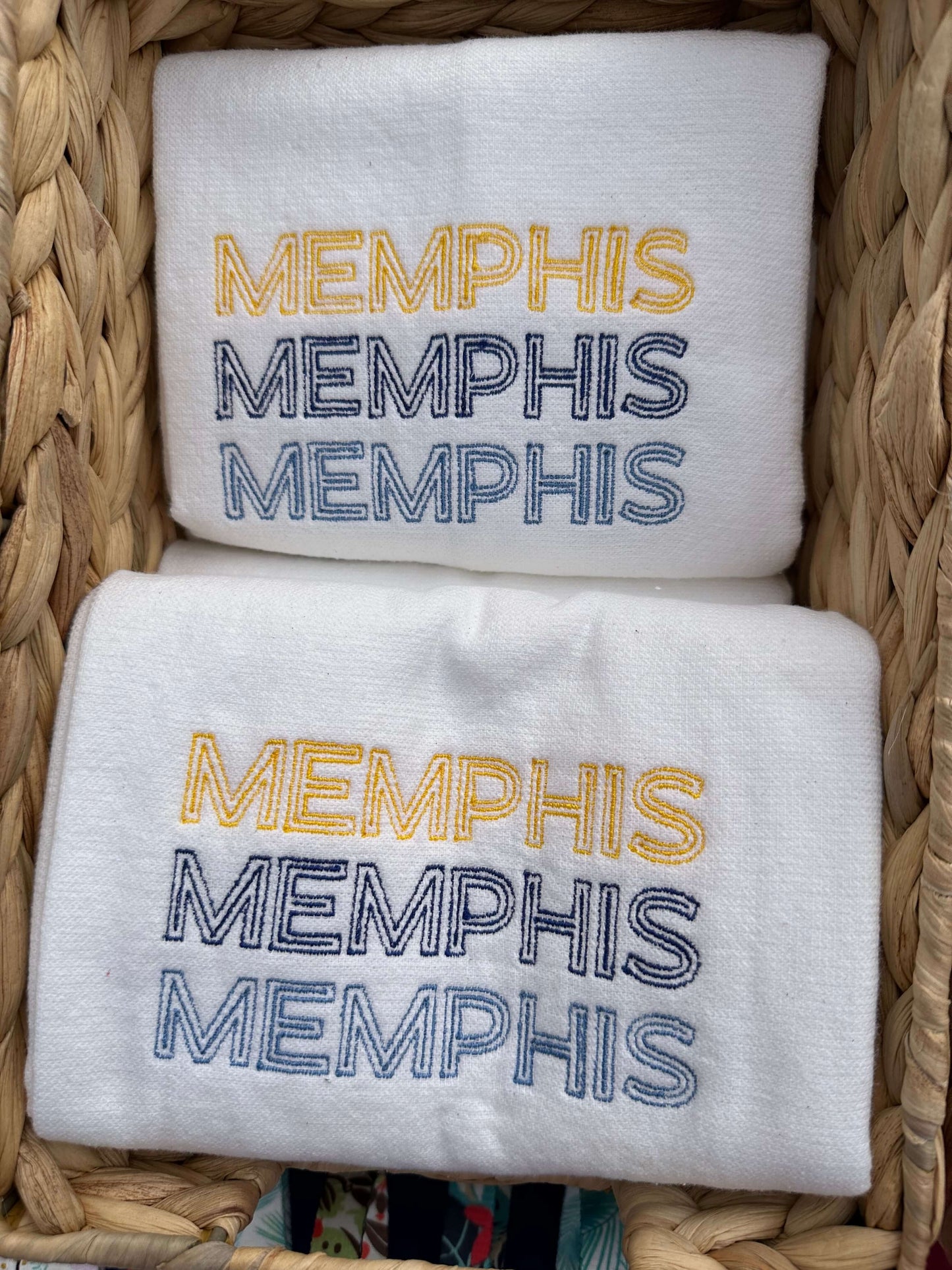100% cotton tea towel featuring MEMPHIS three times in a stacked design in grizzlies brand colors