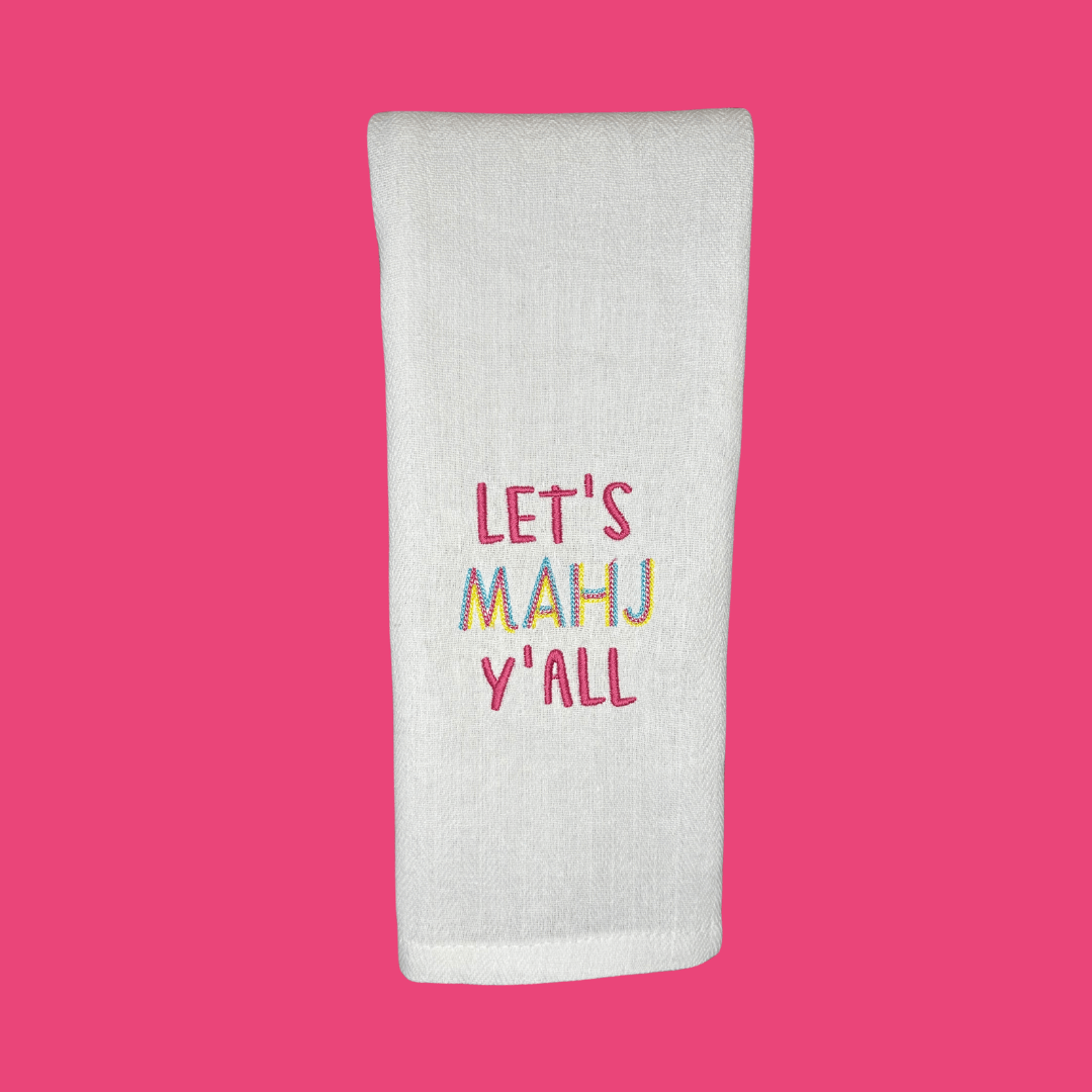 Let's MAHJ Ya'll tea towel embroidered in bright, fun colors