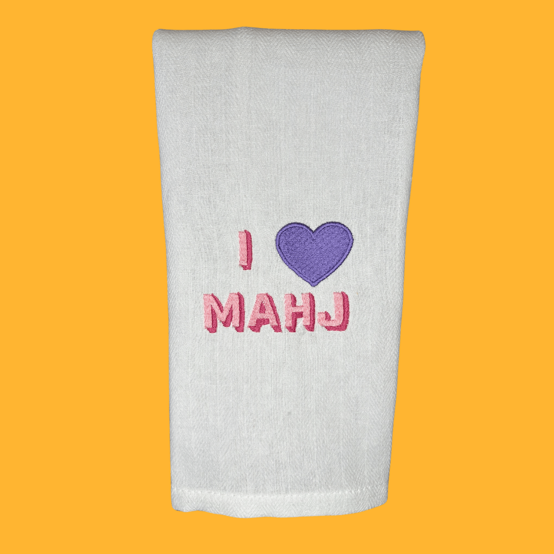 i heart mahjong embroidered on a tea towel in bright, fun colors